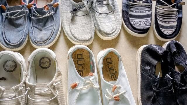 Eight pairs of casual slip-on shoes.