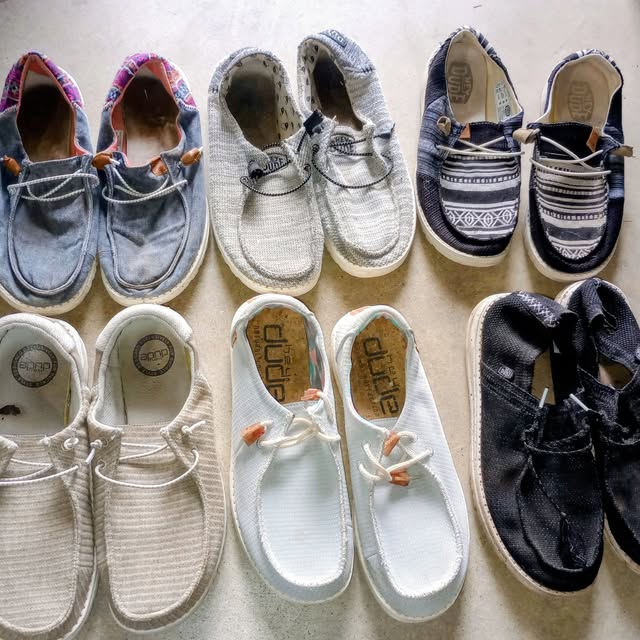 Eight pairs of casual slip-on shoes.