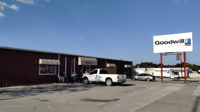 Goodwill store with parked white truck.