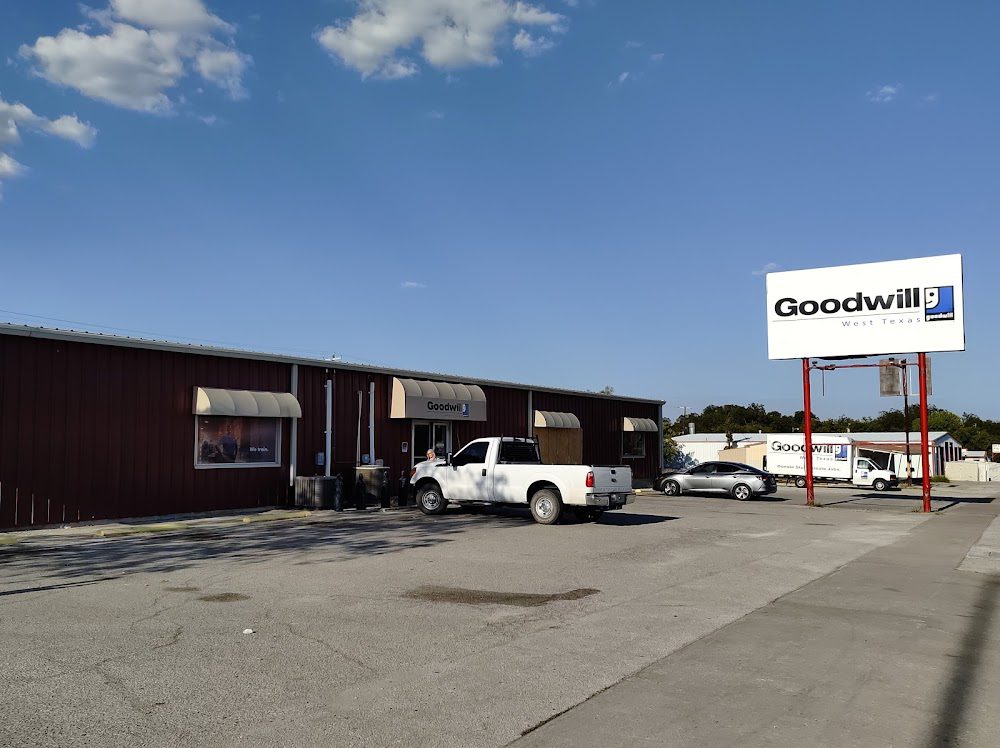 Goodwill store with parked white truck.